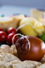 Traditional Italian hard cheese Provolone of Caciocavallo, smoked and white