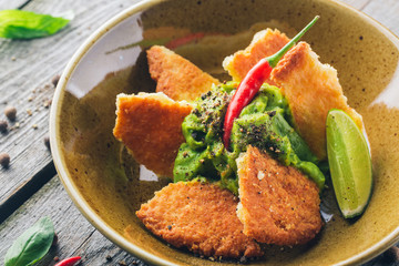 Cheese cookies with spicy avocado cream