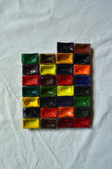 Composition of tubes of multi-colored watercolor paints