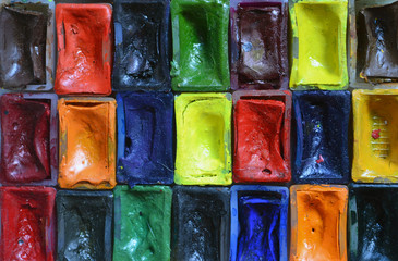 Composition of tubes of multi-colored watercolor paints