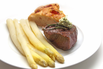 Beef fillet with asparagus and focaccia with tomatoes