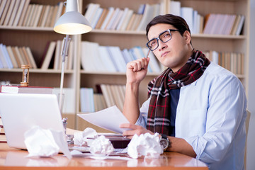 Young writer working in the library