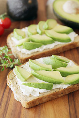 Avocado and cream cheese on wholemeal bread - shallow dof