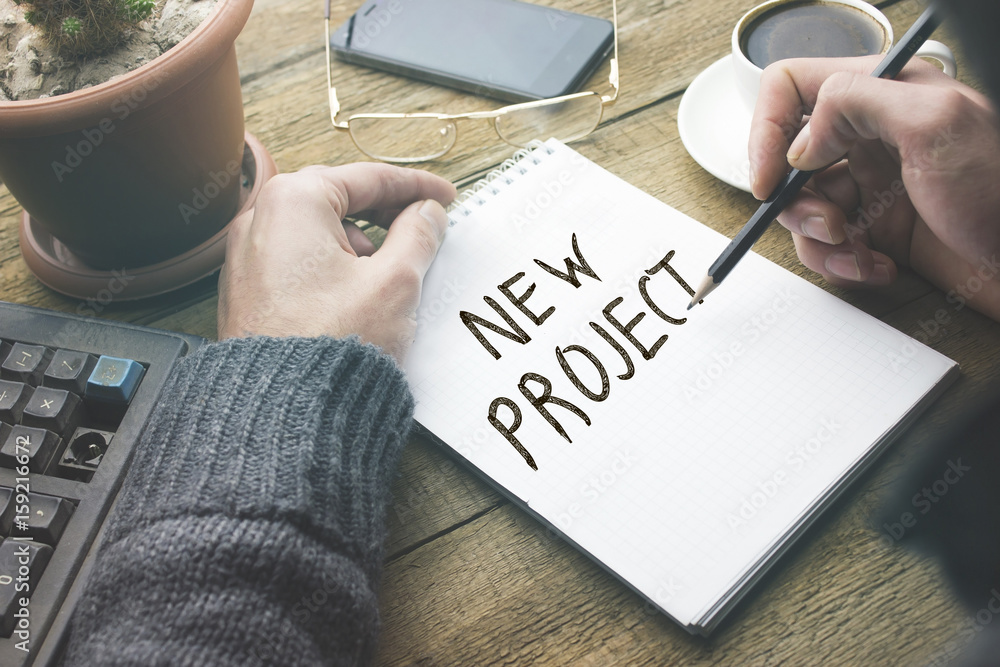 Poster man written new project text on page