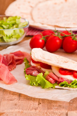 Piadina with ham and lettuce. 