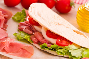 Piadina with ham and lettuce. 