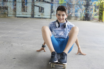boy with skateboard on the street