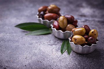Bowls with different Mediterranean olives