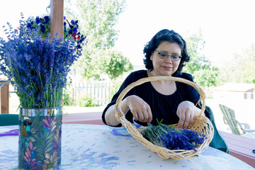 Hispanic Woman Creating Lavender Flower Bouquet