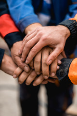 business, building, teamwork and people concept - group of smiling builders outdoors