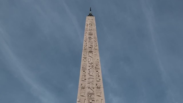 High obelisk in Rome Piazza del Popolo low angle shot, famous landmark motion hyper lapse