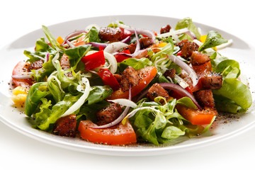 Salad with smoked ham on white background 