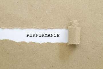 Performance word written under torn paper.