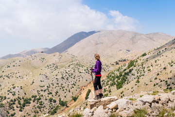 Hiking woman in a mountains