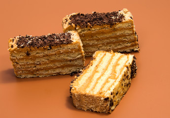 biscuit Swiss roll isolated on brown background