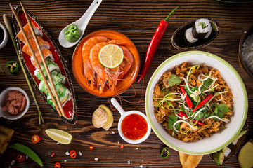 Various of asian meals on rustic background , top view , place for text.