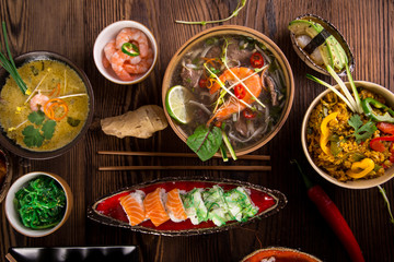 Various of asian meals on rustic background , top view , place for text.