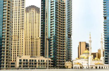 Fototapeta na wymiar Skyscrapers at cloudy day in Dubai, United Arab Emirates ( UAE ). Beautiful cityscap