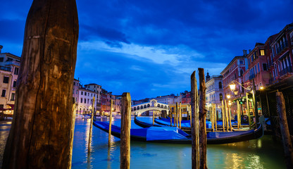 Panoramic view of Rialto bridge and Garnd Canal at night in Venice, Italy