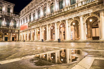 Fototapeta premium Night view of San Marco with reflecion in reflection in a puddle. Venice, Italy