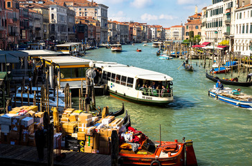 Panoramic view on famous Grand Canal among historic houses in Venice, Italy at sunny day. Picture took from the Rialto bridge.