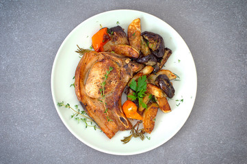 Grilled pork steak and vegetables on the grill. Horizontal, rustic style. Wooden background. Close-up. Top view