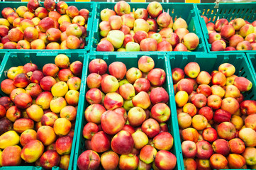 Apples on boxes in supermarket