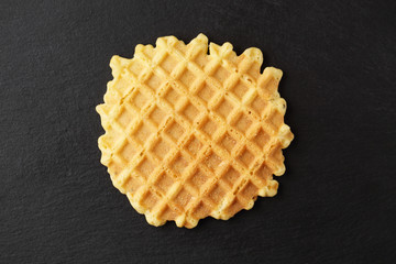 Ruddy wafer on a plate of slate