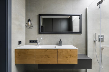 Fototapeta na wymiar Gray bathroom with countertop basin