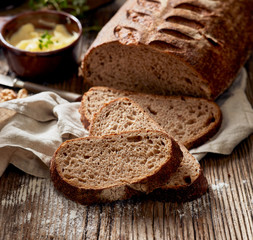 Sliced rustic bread on a wooden table