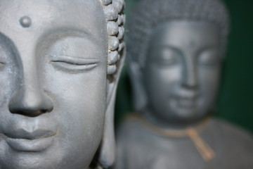 Buddha statues with green background 