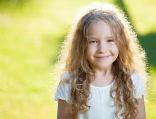 Laughing girl on grass