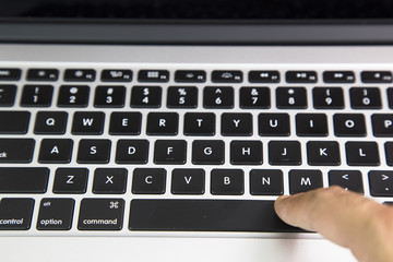 Work for the laptop. Hands and keyboard close-up 