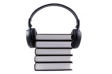 books with headphones. Audio book concept