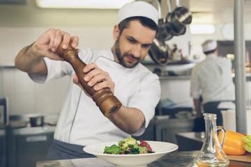  Man japanese restaurant chef cooking in the kitchen