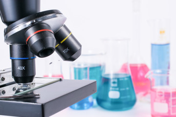 laboratory beakers and microscope 