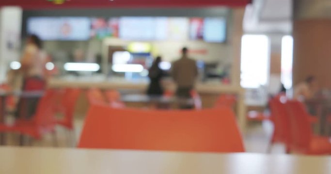 Blurred people by the counter of cafee