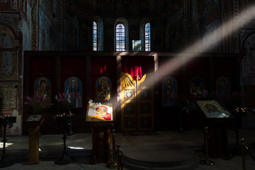 Ray of light falls on the icon of the Mother of God