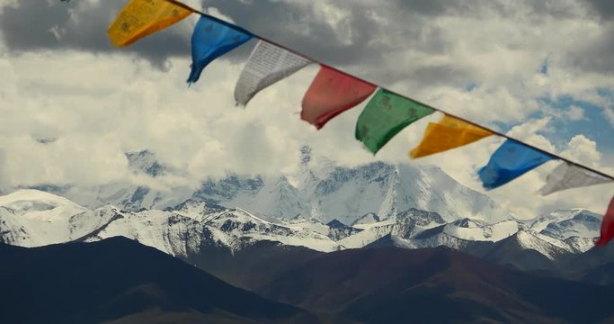 4k huge clouds mass rolling over lake namtso & Tanggula snow mountain peak,tibet mansarovar,pray flag in wind,Tibet's second largest lake,the third largest saltwater lake in China.roof of the World.