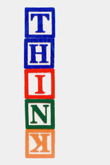 THINK concept with backward, upside down letter K.