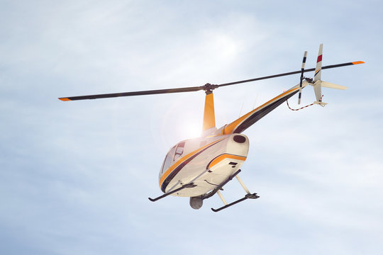 Small turbine helicopter in flight with camera and FLIR equipment