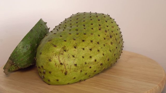 Soursop, Annona muricata L with slice rotate on wooden cutting board