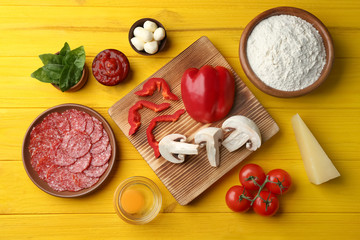 Ingredients for pizza on wooden  background