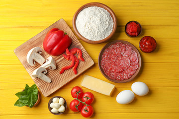 Ingredients for pizza on wooden  background