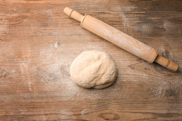 Fresh dough  on wooden background