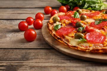 Tasty pizza on wooden table, close up