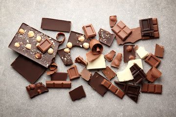 Heap of broken chocolate pieces on table