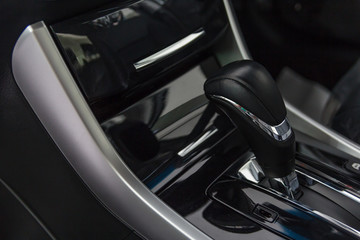 Obraz na płótnie Canvas Detail of modern car interior focus on gear stick, Automatic transmission in luxury car