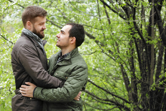 Romantic gay couple in park