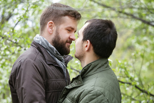 Romantic gay couple in park